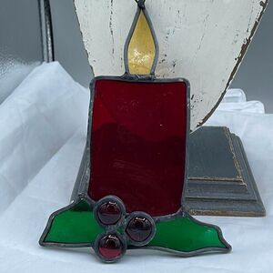 Vintage Christmas stained glass candle with holly sun catcher.